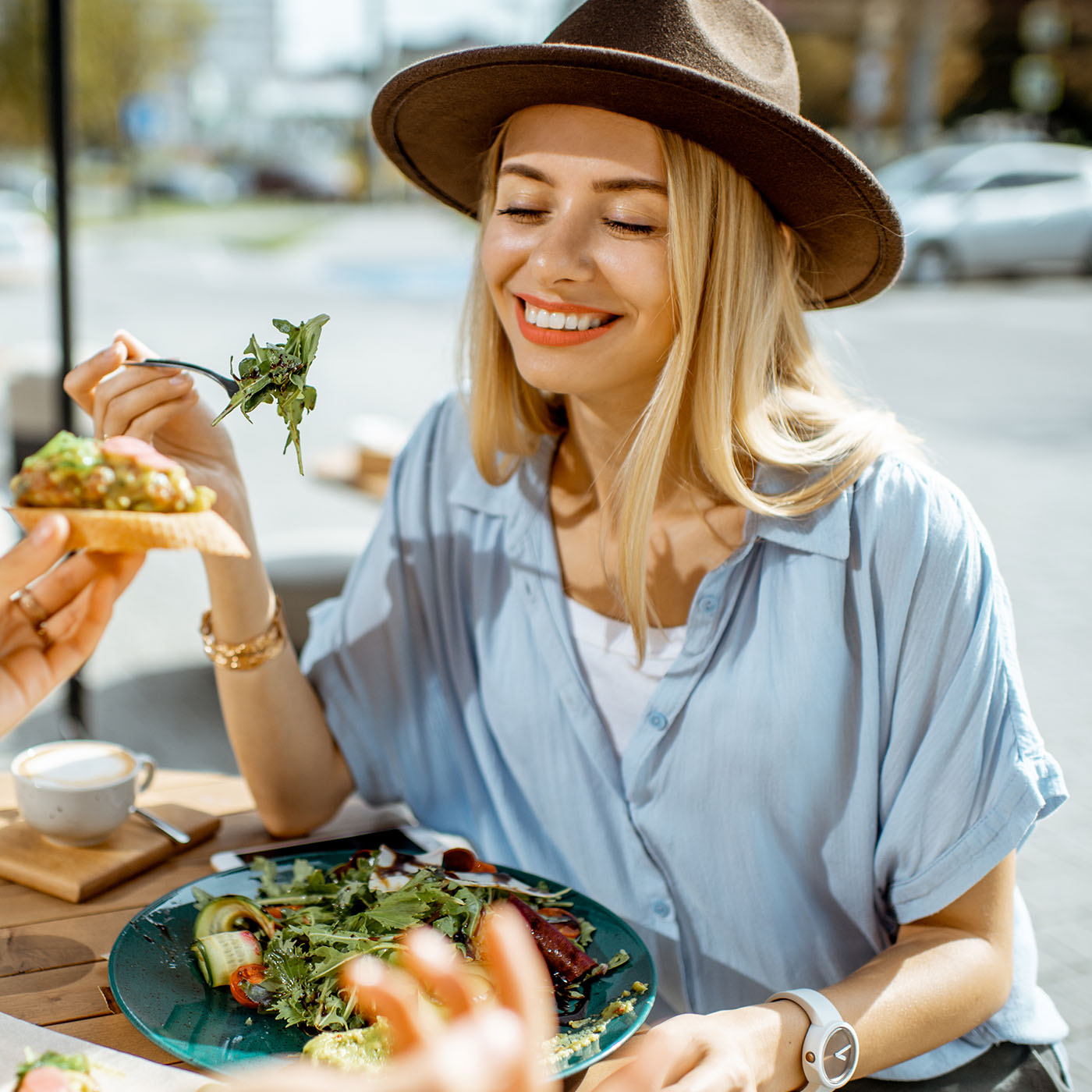 girlfriends-eating-healthy-food-on-a-terrace-2022-01-18-23-53-55-utc.jpg